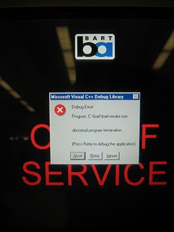 A picture of the screen on a BART ticket terminal with a Windows error dialog indicating a C++ crash.